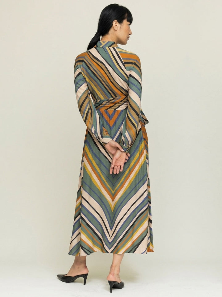 model wearing stripe print wrap dress n neutral background back view 